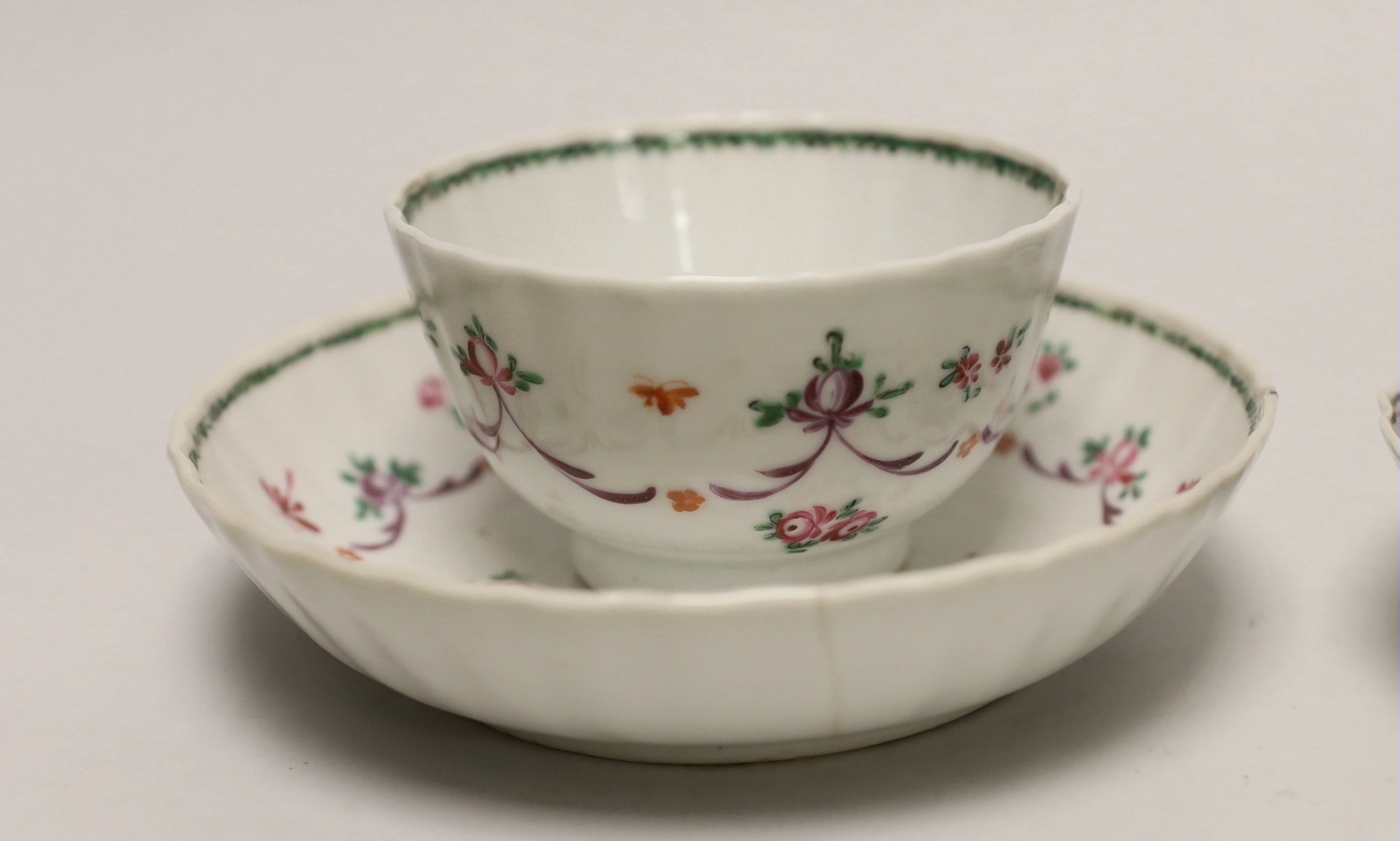 Three 18th century Chinese famille rose tea bowls and matching saucers, a Caughley teabowl and saucer and a single tea bowl and smaller tea bowl